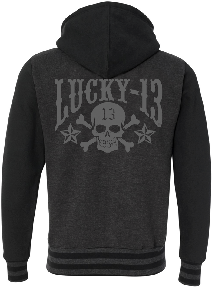 back of Lucky 13 charcoal gray heather black zip-up hooded sweatshirt has jacquard ribbing at cuffs and waistband and gunmetal eyelets. Hoodie has classic "Skull Stars" logo in grey (tonal) on the back with the skull stars embroidered patch (also tonal in dark charcoal) on the front left chest.