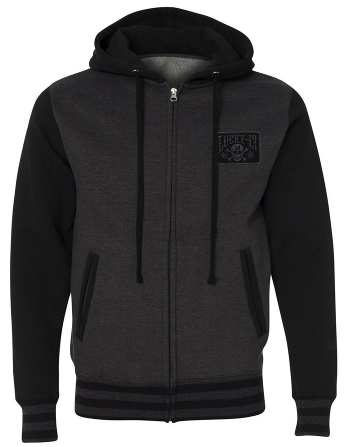 front of Lucky 13 charcoal gray heather black zip-up hooded sweatshirt has jacquard ribbing at cuffs and waistband and gunmetal eyelets. Hoodie has classic "Skull Stars" logo in grey (tonal) on the back with the skull stars embroidered patch (also tonal in dark charcoal) on the front left chest.