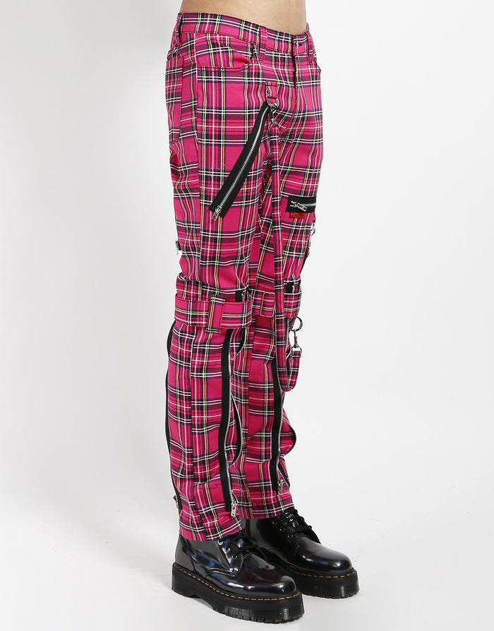side of Pants feature removable bondage straps and zipper details. Pant legs can be zipped for a change in fit, topped off with a zip fly and button closure.