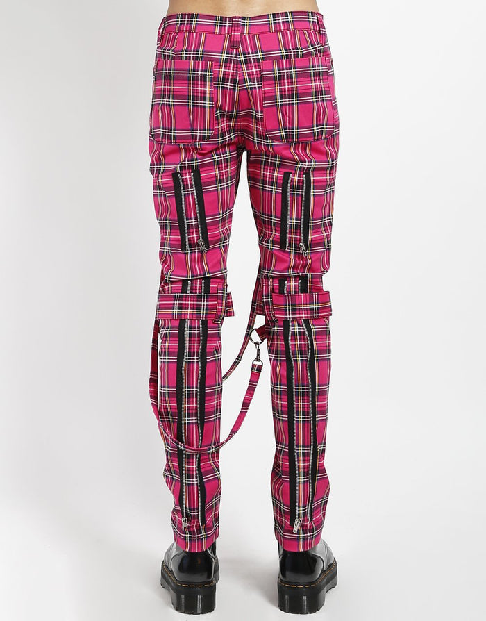 back of Pants feature removable bondage straps and zipper details. Pant legs can be zipped for a change in fit, topped off with a zip fly and button closure.