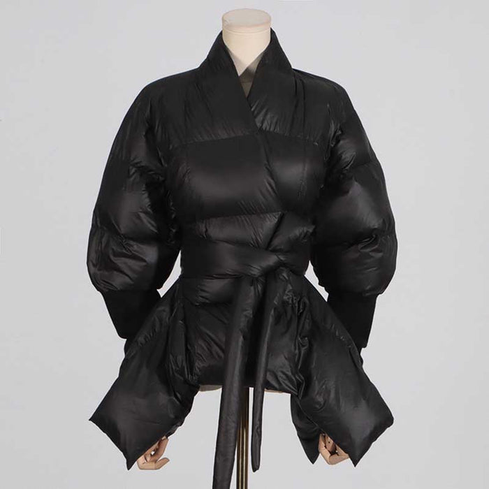 Stylish women's black winter coat with belt, featuring a unique puffy design and wrap style
