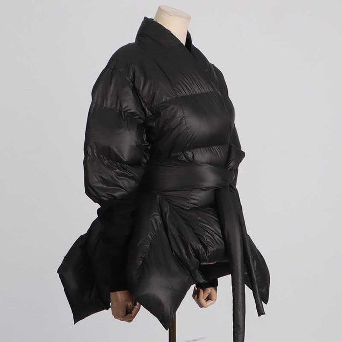 Stylish women's black winter coat with belt featuring a puffy design for warmth and comfort
