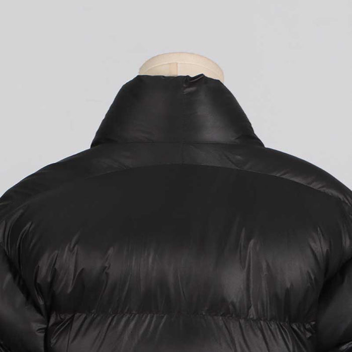 Women's black winter coat with belt featuring a cozy puffy design for warmth and style