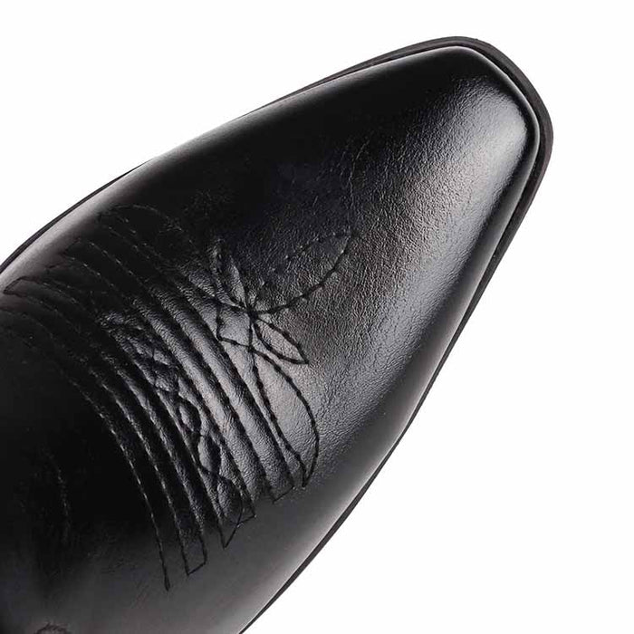 Close-up of women's embroidered cowboy boots showcasing intricate stitching and sleek design