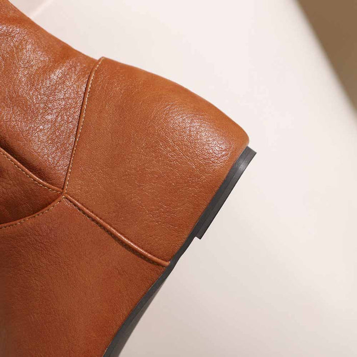 Close-up of sd-hk women's round toe wedge boots in brown leather showcasing the heel detail
