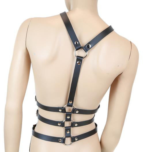 mannequin displaying back side of black leather y shaped body harness. shows three adjustable buckles on each side of torso and silver o ring details