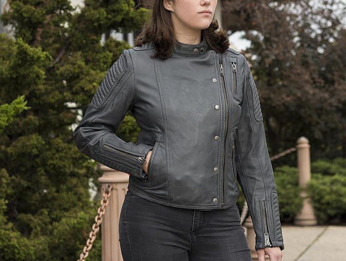 model wearing Black leather sheepskin jacket. Jacket is designed to have a classic fit, has zip sleeves, two side hand pockets, one chest pocket and two interior pockets. Jacket is fully lined.